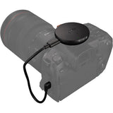 Syrp Genie Micro Camera Control hub on camera top with connected cable