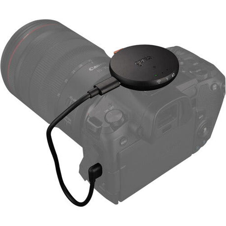 Syrp Genie Micro Camera Control hub on camera top with connected cable