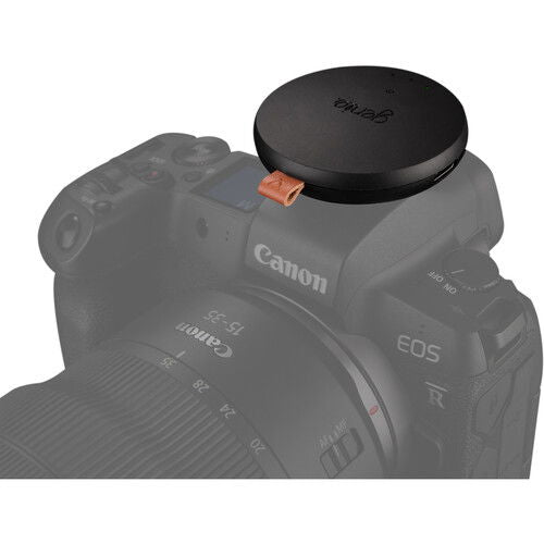 Syrp Genie Micro Camera Control on camera with top puck and leather strap