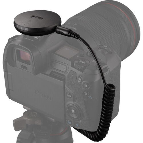 Syrp Genie Micro Camera Control puck connected to camera via coiled cable