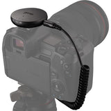 Syrp Genie Micro Camera Control puck connected to camera via coiled cable