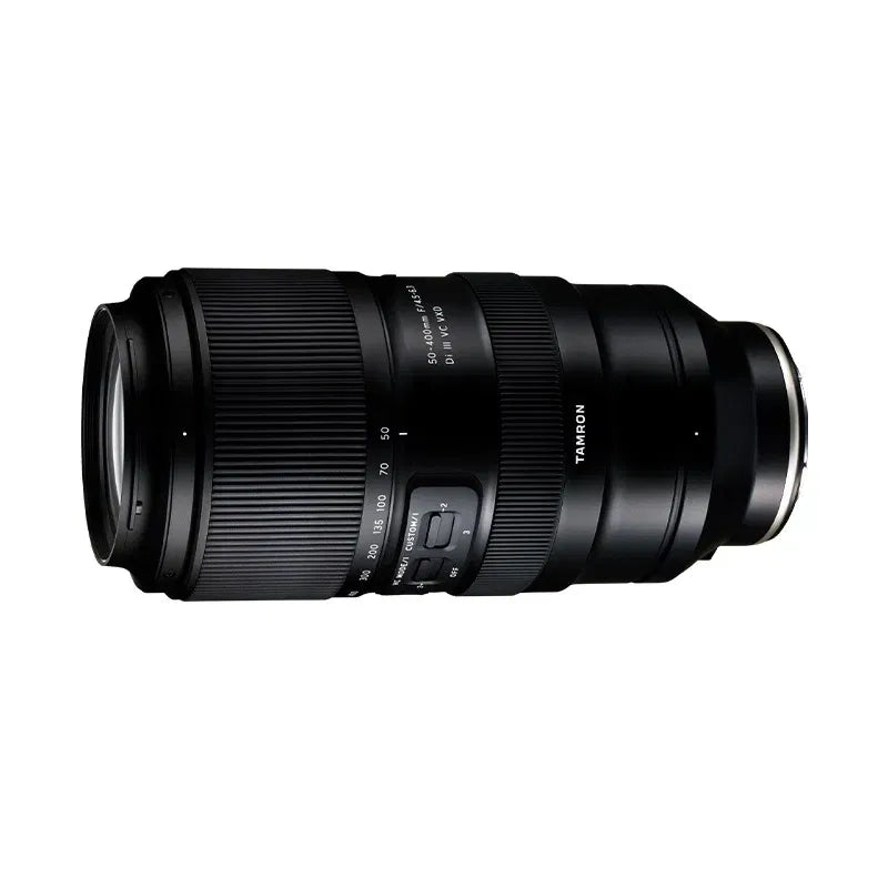 Black zoom telephoto camera lens showing side markings and adjustment buttons