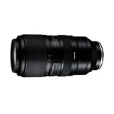 Black zoom telephoto camera lens showing side markings and adjustment buttons