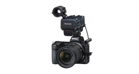 Camera-mounted XLR audio adapter unit with mounting bracket and cable connector, black