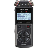 Tascam portable audio recorder with LCD screen, transport buttons, and two metal mic caps