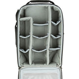Interior view: gray organizer panels and mesh pockets in dark rolling backpack