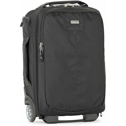 Dark rolling backpack front view with main zipper compartment and caster wheels