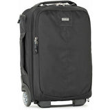 Dark rolling backpack front view with main zipper compartment and caster wheels