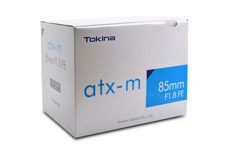 Tokina atx-m 85mm F1.8 FE lens retail box with product label and blue panel