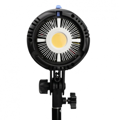 LED video light with circular COB lens and front grille, close-up view