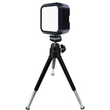 Square LED light on mini tripod with white diffuser, unlit RGB tones