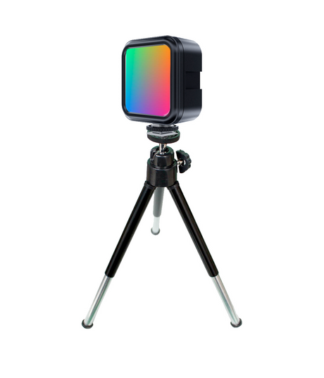 RGB LED mini tripod light with square diffuser glowing in green-orange-pink