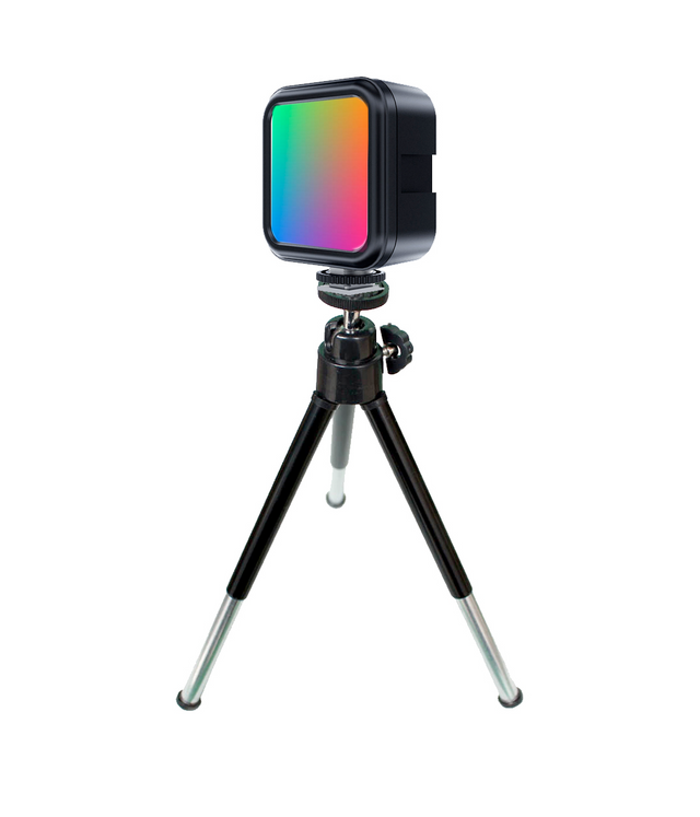 RGB LED mini tripod light with square diffuser glowing in green-orange-pink