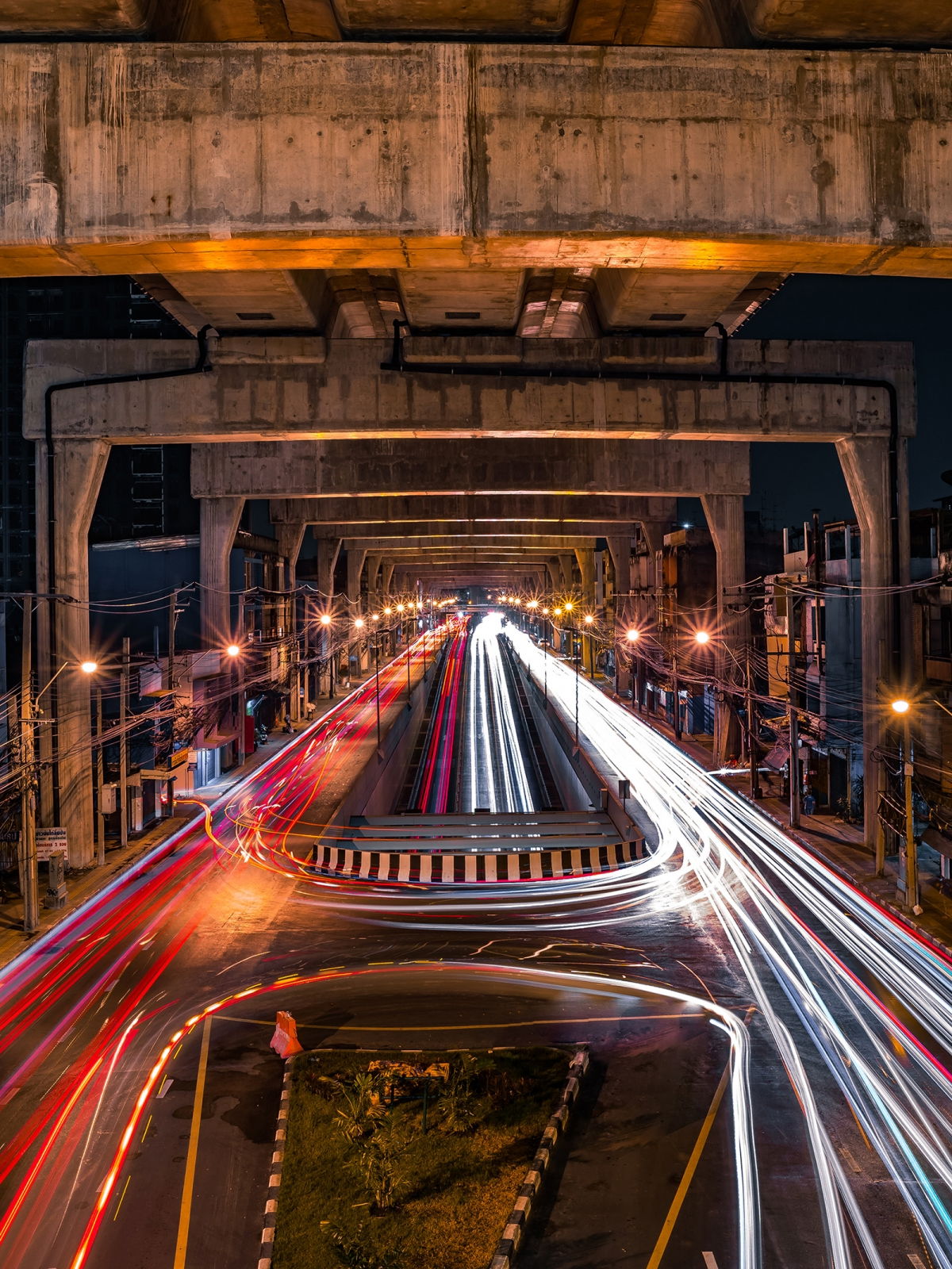 Bridge view with long-exposure light trails from passing vehicles