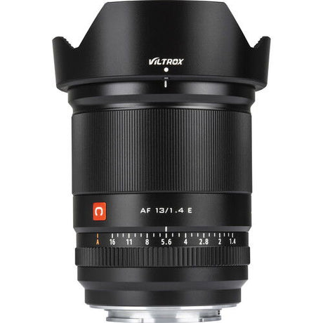 Front housing close-up of black 13mm f/1.4 E lens with AF 13/1.4 label