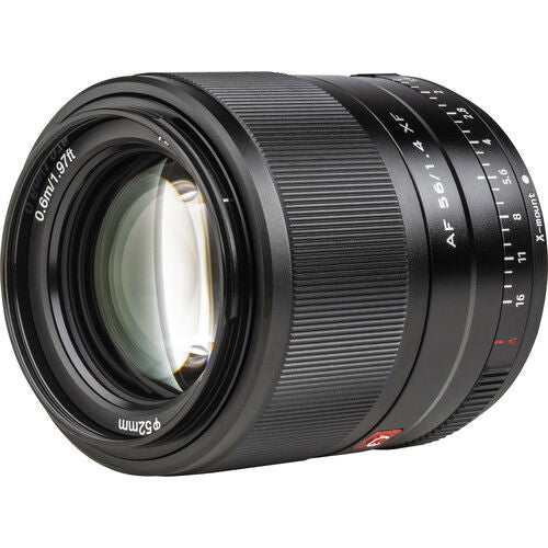 Front view of black 56mm f/1.4 AF lens with glass element and focus scale