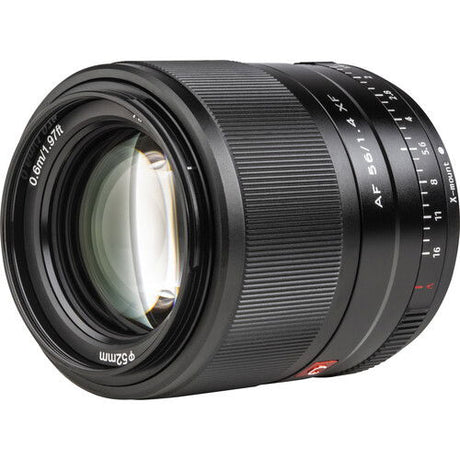 Front view of black 56mm f/1.4 AF lens with glass element and focus scale