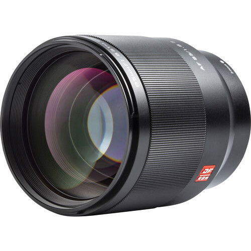 Black 85mm f/1.8 lens angled front view with visible engraved ring