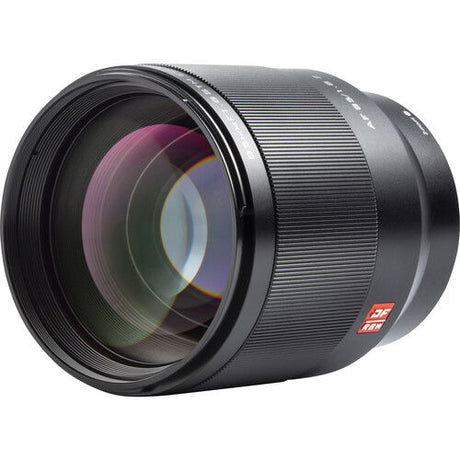 Black 85mm f/1.8 lens angled front view with visible engraved ring