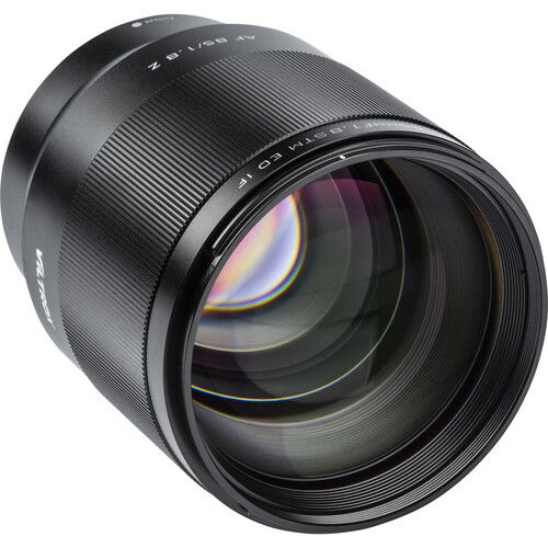 Black 85mm f/1.8 lens side view, ribbed barrel and front optic