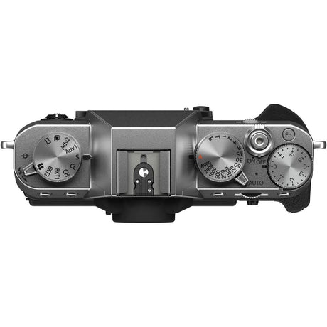 Mirrorless camera top view, mode dial and shutter controls, black textured grip