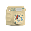 Cream mini digital camera with PEANUTS YASHICA logo and star accents