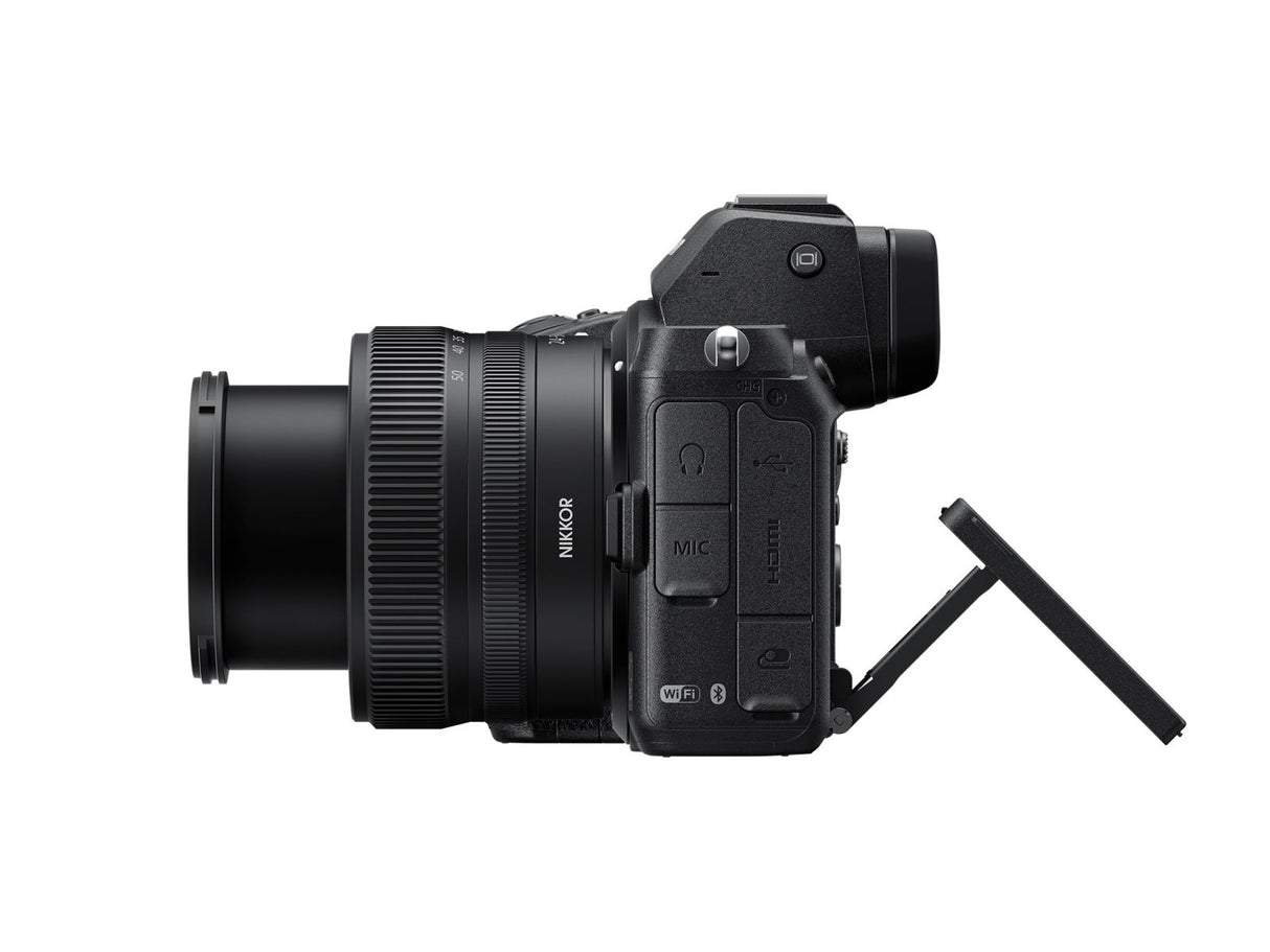 Side view of black mirrorless camera with 24-50mm lens and ports panel
