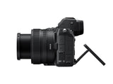 Side view of black mirrorless camera with 24-50mm lens and ports panel