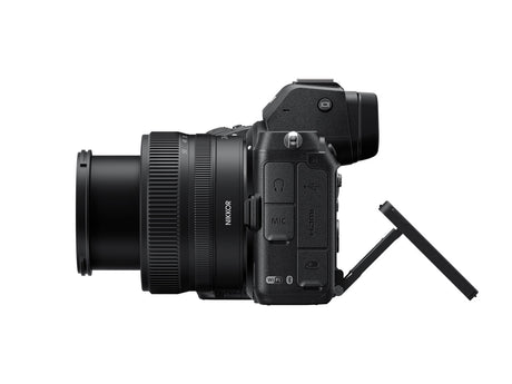 Side view of black mirrorless camera with 24-50mm lens and ports panel