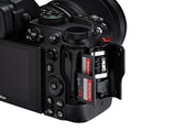 Mirrorless camera with SD card slot open and side control buttons