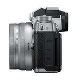 Side view of mirrorless camera with attached 16–50mm zoom lens