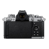 Rear view mirrorless camera kit with textured grip and attached zoom lens