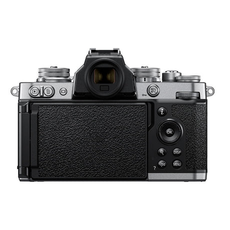Rear view mirrorless camera kit with textured grip and attached zoom lens