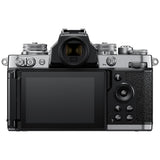 Mirrorless camera with rear LCD screen and attached zoom lens