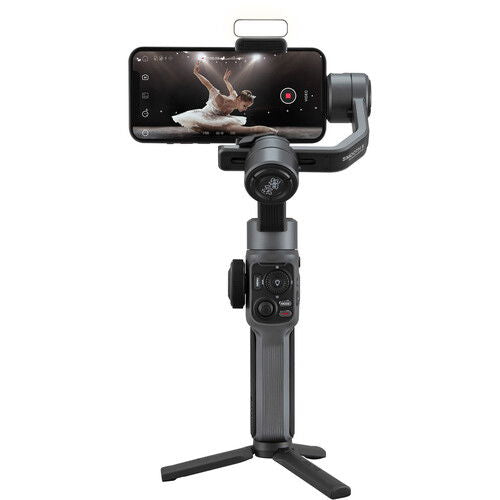 Smartphone gimbal stabilizer with phone mounted and three-axis arms on tripod base