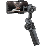 Angled smartphone gimbal stabilizer with phone clamp and control dials on the handle