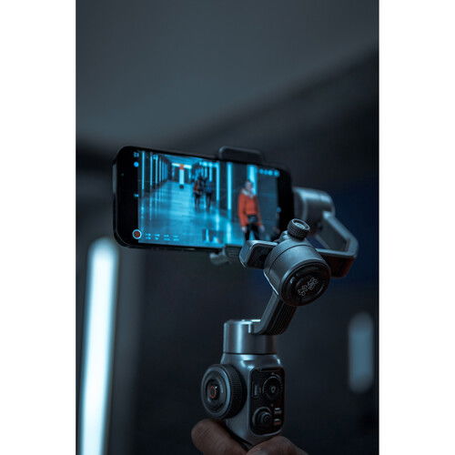 Smooth 5S gimbal filming setup with phone mounted on stabilizer handle