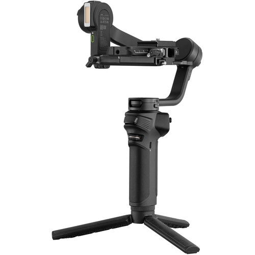 Side view of Weebill 3S handheld gimbal stabilizer, black, on foldout tripod legs