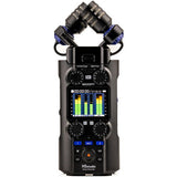 Handheld audio recorder with dual microphones, waveform screen, and front control dials